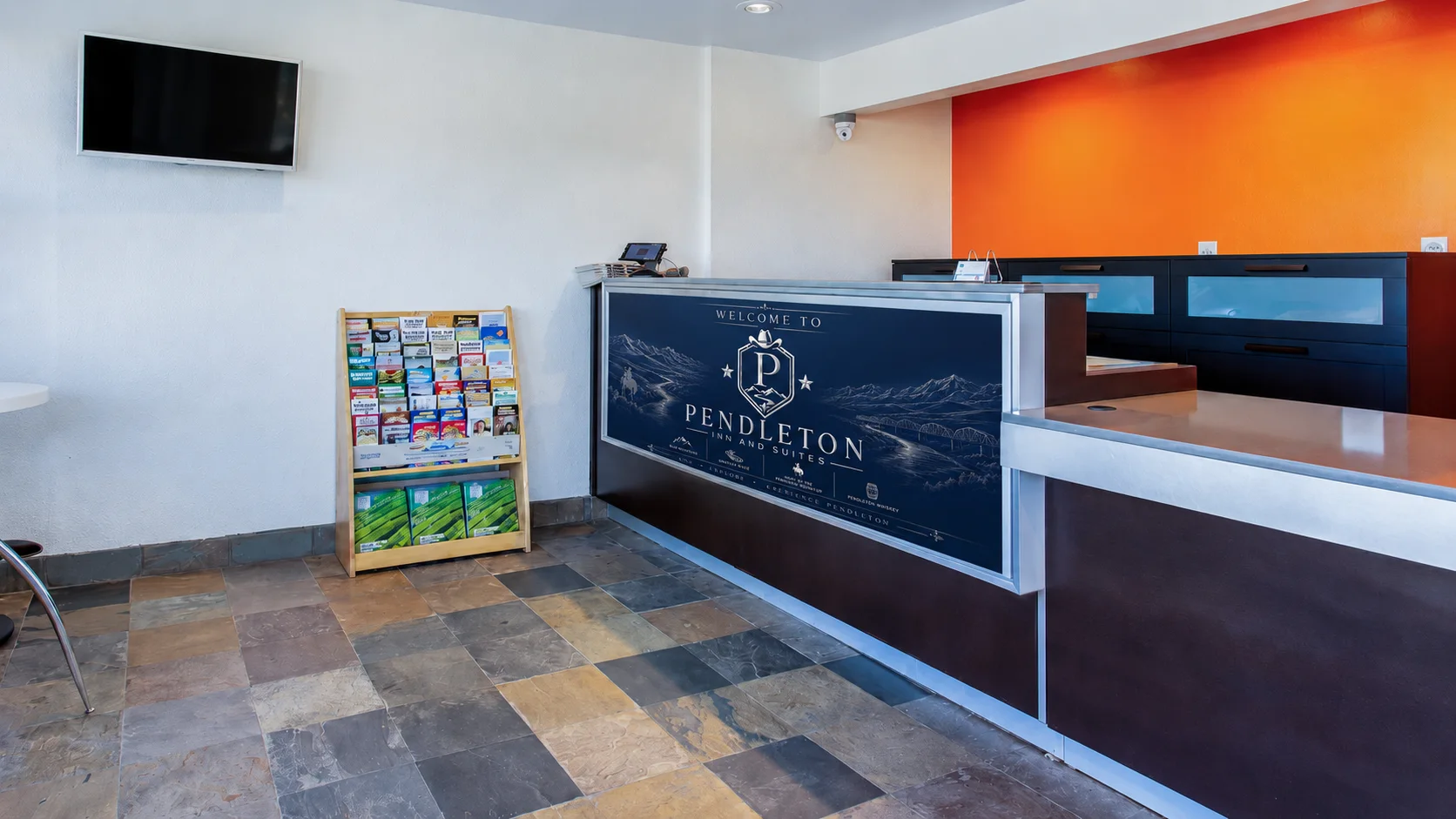 Pendleton Inn and Suites lobby and front desk featuring the property’s Pendleton artwork